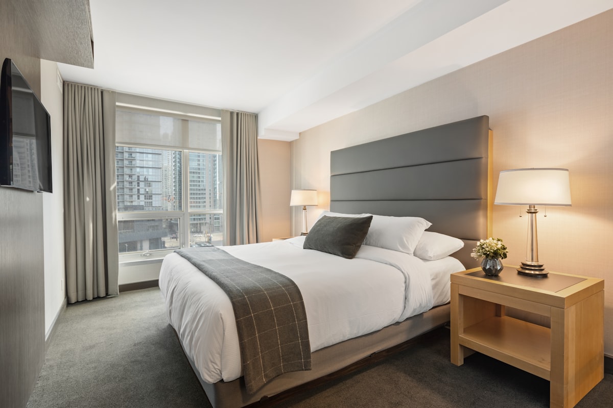 Extended-stay hotel room with workspace